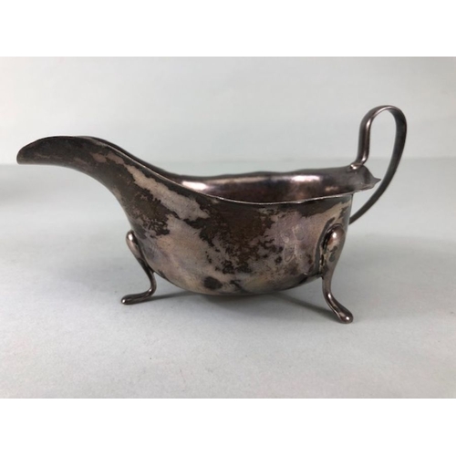 16 - silver, English silver hallmarked sauce boat on 3 legs  Sheffield 1881 approximately 97.3g