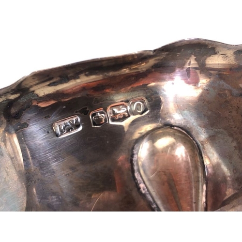 16 - silver, English silver hallmarked sauce boat on 3 legs  Sheffield 1881 approximately 97.3g