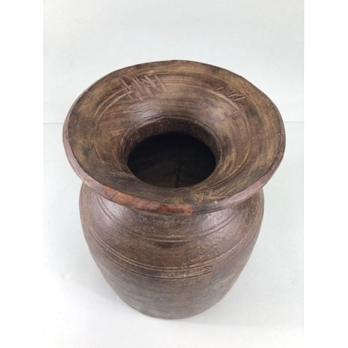 161 - Tribal interest, two Asia turned wooden Ghee pots of classic form the larger approximately 26cm high