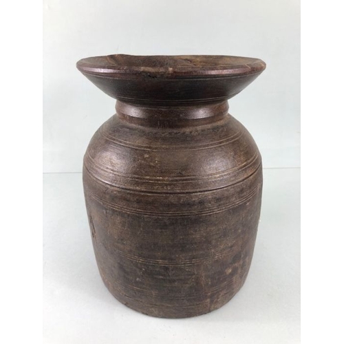 161 - Tribal interest, two Asia turned wooden Ghee pots of classic form the larger approximately 26cm high