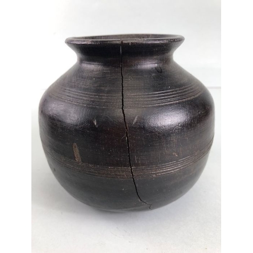 161 - Tribal interest, two Asia turned wooden Ghee pots of classic form the larger approximately 26cm high