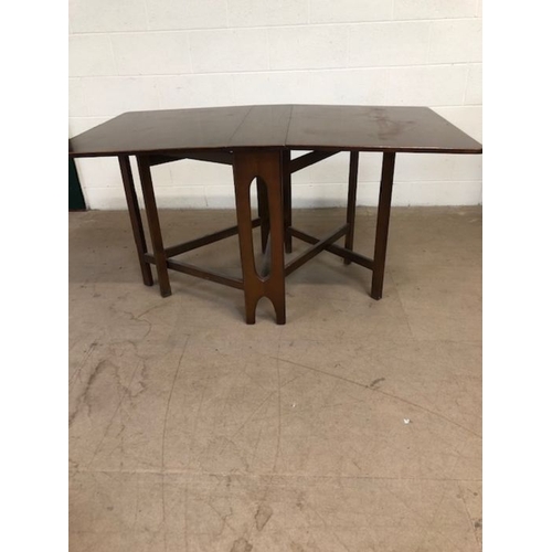 164 - Mid century furniture, Dining set comprising of a drop leaf table and 6 chairs, the table with 2 fol... 