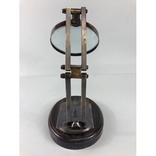 197 - Scientific style magnifying glass  on adjustable metal stand with wooden base approximately 28ch hig... 