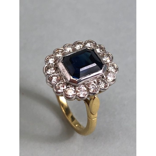 20 - 18ct yellow gold cluster ring ,cushion cut sapphire surrounded by diamonds mounted on a 18ct yellow ... 