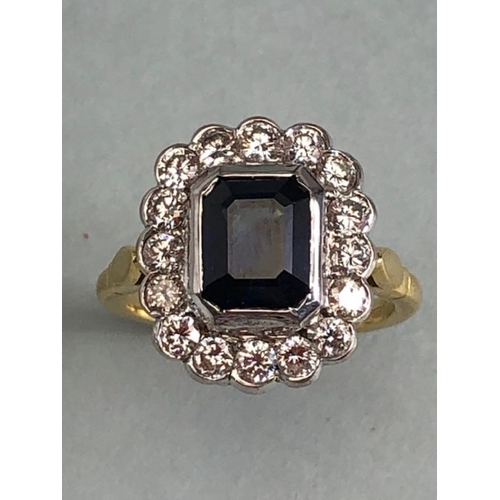 20 - 18ct yellow gold cluster ring ,cushion cut sapphire surrounded by diamonds mounted on a 18ct yellow ... 