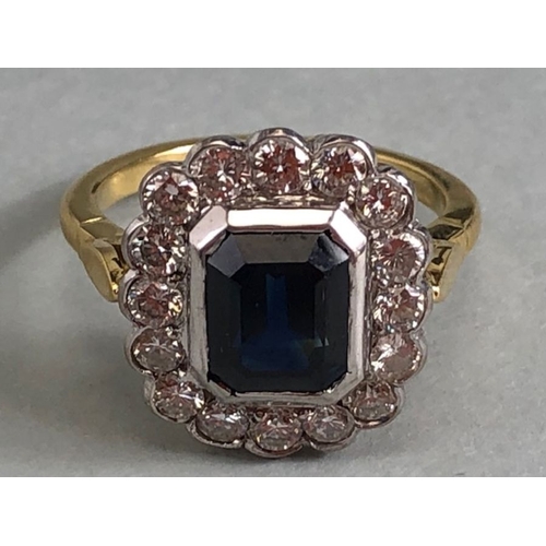 20 - 18ct yellow gold cluster ring ,cushion cut sapphire surrounded by diamonds mounted on a 18ct yellow ... 