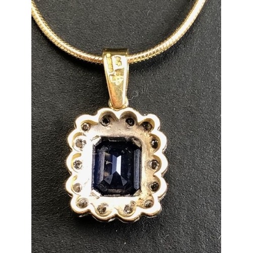 21 - 18ct sapphire and diamond pendant, cushion cut sapphire surrounded by diamonds on a rolled serpentin... 