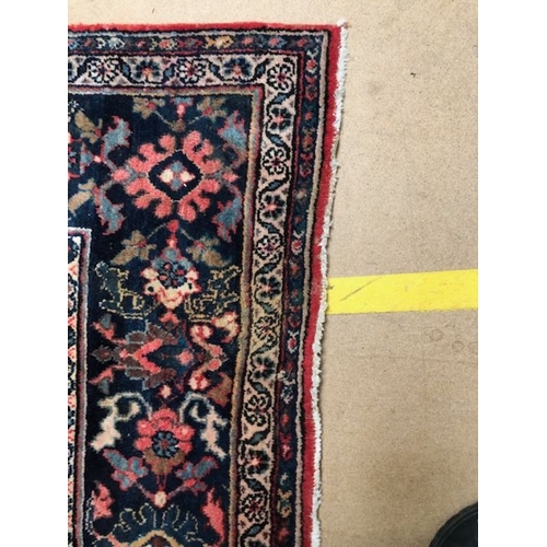 219 - Oriental rug, large wool eastern rug with flower and arabesque designs approximately 382 x 274cm