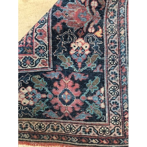 219 - Oriental rug, large wool eastern rug with flower and arabesque designs approximately 382 x 274cm