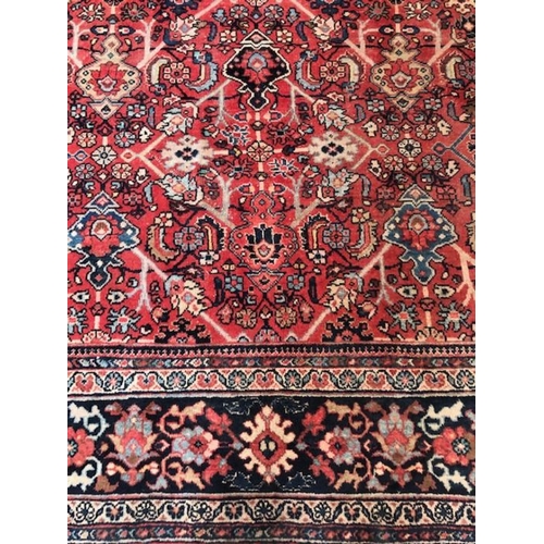 219 - Oriental rug, large wool eastern rug with flower and arabesque designs approximately 382 x 274cm