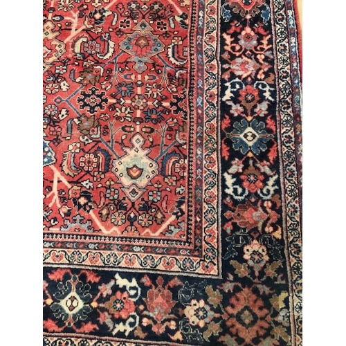 219 - Oriental rug, large wool eastern rug with flower and arabesque designs approximately 382 x 274cm