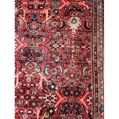 219 - Oriental rug, large wool eastern rug with flower and arabesque designs approximately 382 x 274cm