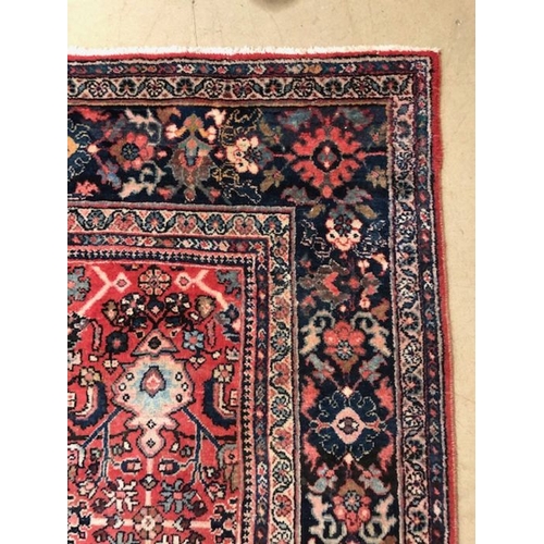 219 - Oriental rug, large wool eastern rug with flower and arabesque designs approximately 382 x 274cm