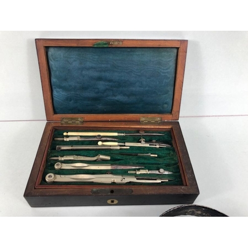 228 - 19th century partial mahogany cased drawing instruments set and 2 Bronze shop or servants bells on s... 