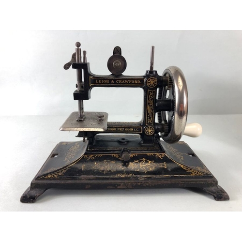 229 - Sewing Machine, Antique child's portable sewing machine by Leigh and Crawford with cover