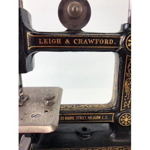 229 - Sewing Machine, Antique child's portable sewing machine by Leigh and Crawford with cover