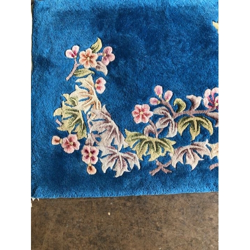 235 - Oriental rug, Chinese wool Rug with pattern of sculpted flowers on a blue background approximately 1... 