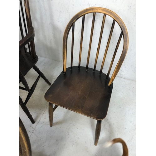 242 - Six stick back Ercol dining chairs, and two wheel back carver chairs