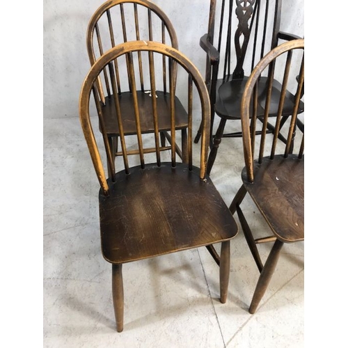 242 - Six stick back Ercol dining chairs, and two wheel back carver chairs