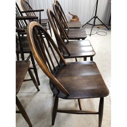 242 - Six stick back Ercol dining chairs, and two wheel back carver chairs