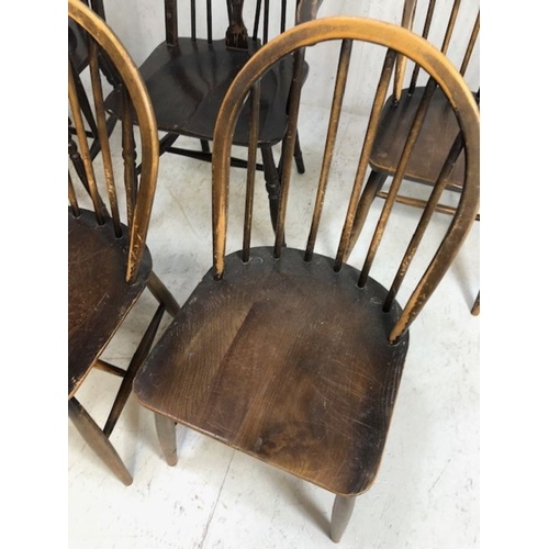 242 - Six stick back Ercol dining chairs, and two wheel back carver chairs