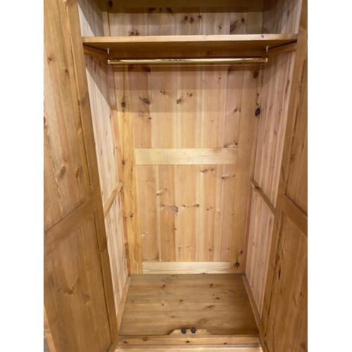 245 - Small pine two door wardrobe with shelf and hanging rail, approx 95cm x 60cm x 190cm