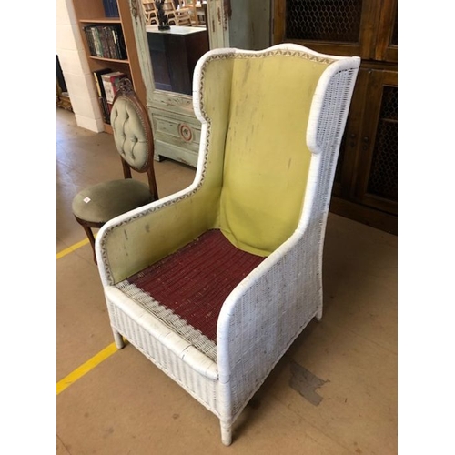 248 - White cane wingback armchair with upholstered lining (no cushions), approx 114cm in height (at back)