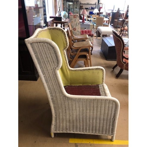 248 - White cane wingback armchair with upholstered lining (no cushions), approx 114cm in height (at back)