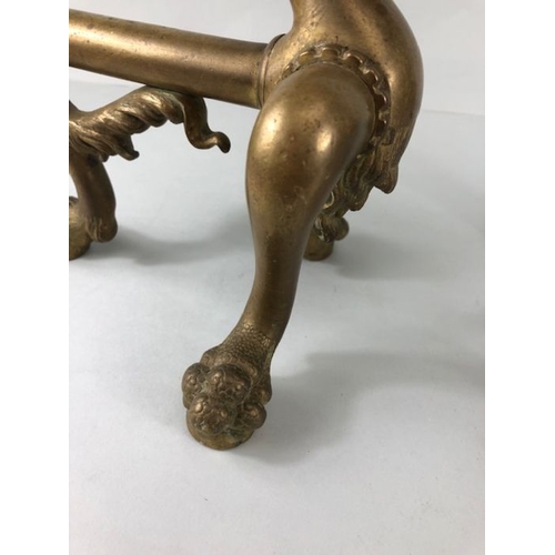 257 - Brass fire dogs, a pair of Ball and Claw fire dogs on 3 claw and ball feet approximately 27cm high