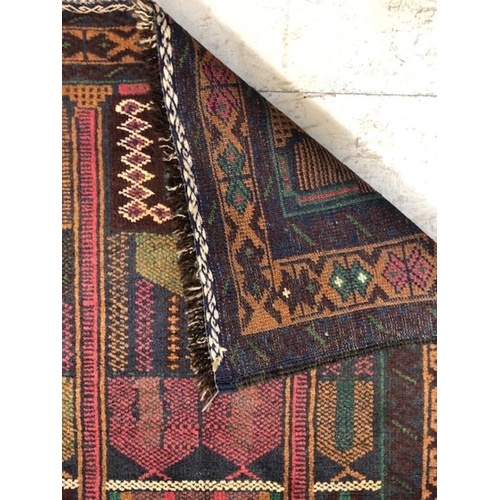 273 - Oriental Rug, Hand Knotted Wool  Old Baluchi Rug with geometric design approximately 136 x 79cm.