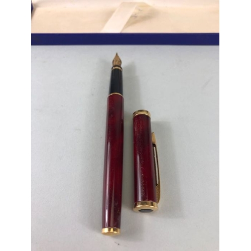 276 - Fountain pens, two Waterman fountain pens  one red lacquered with 18ct nib in box, the other brush f... 