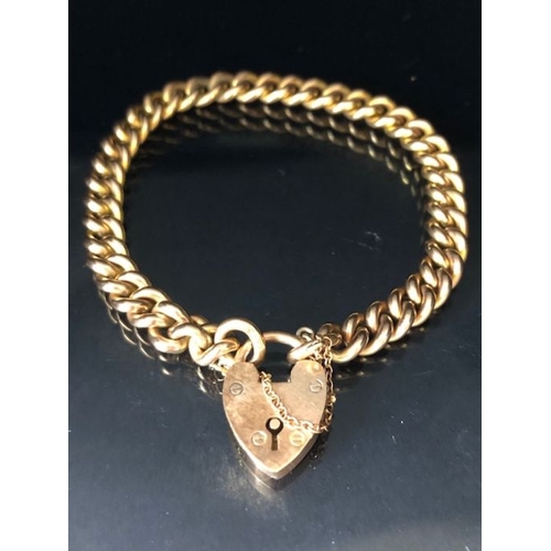 31 - 9ct Gold curb link bracelet with 9ct Gold heart shaped clasp and safety chain approx 16cm in length ... 