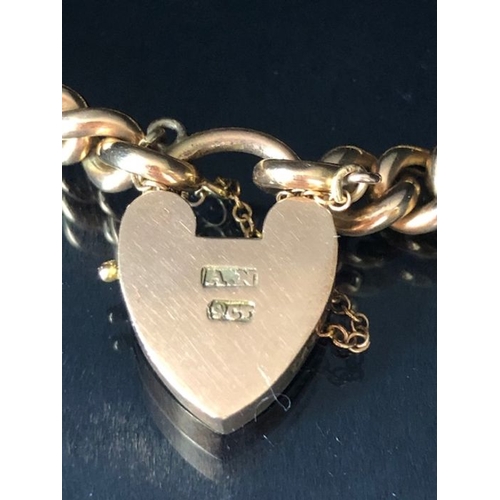 31 - 9ct Gold curb link bracelet with 9ct Gold heart shaped clasp and safety chain approx 16cm in length ... 