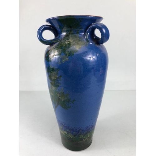 315 - Torquay pottery, a large salt glaze pottery vase with raised and sponge design of a colourful parrot... 