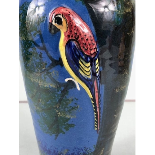 315 - Torquay pottery, a large salt glaze pottery vase with raised and sponge design of a colourful parrot... 