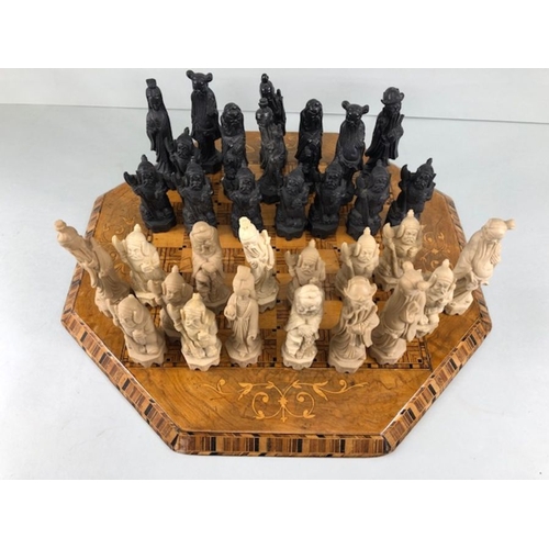 323 - Chess set, antique wooden marquetery chess board  and a chess set of Chinese immortals made from com... 