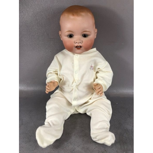 333 - Antique Dolls, a large Armand Marseille bay doll , Stamped A.M Germany 351-/9.K, in a modern baby gr... 