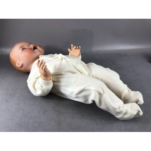 333 - Antique Dolls, a large Armand Marseille bay doll , Stamped A.M Germany 351-/9.K, in a modern baby gr... 