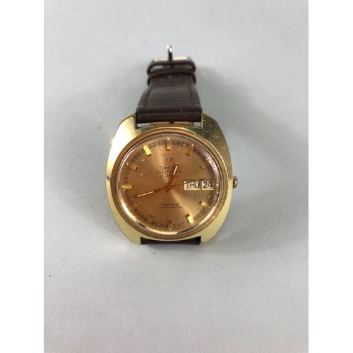 34 - Omega Watch, 1970s Omega Electronic f 300Hz Day Date Chronometer yellow metal case on leather strap,