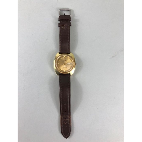 34 - Omega Watch, 1970s Omega Electronic f 300Hz Day Date Chronometer yellow metal case on leather strap,