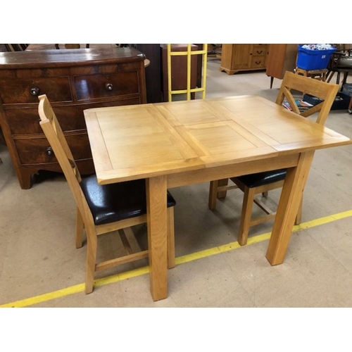 348 - Small modern extending dining / kitchen table and two chairs, table approx 113cm x 80cm fully extend... 