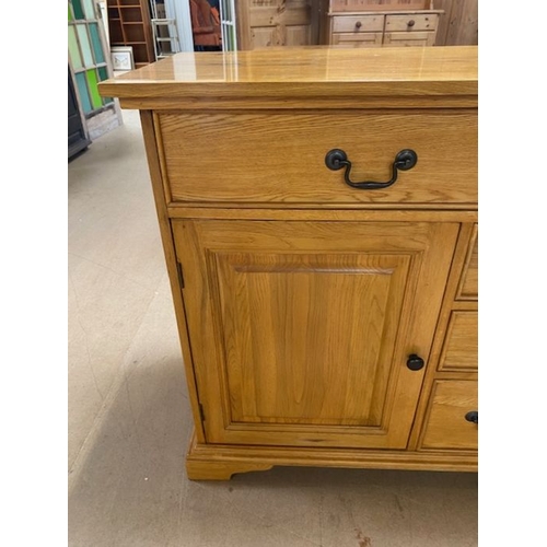 352 - Contemporary polished oak sideboard by 'Shire Oak', with five drawers and two cupboards, approx 137c... 