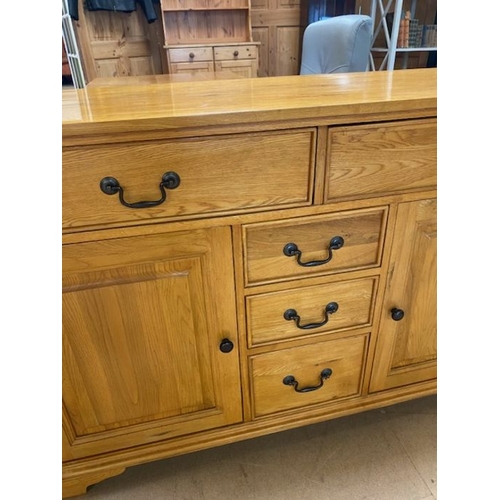 352 - Contemporary polished oak sideboard by 'Shire Oak', with five drawers and two cupboards, approx 137c... 