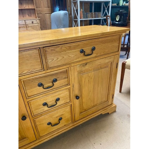 352 - Contemporary polished oak sideboard by 'Shire Oak', with five drawers and two cupboards, approx 137c... 