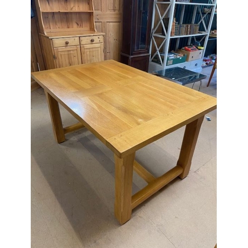 353 - Contemporary polished oak dining table, with stretcher, approx 135cm x 89cm x 75cm tall