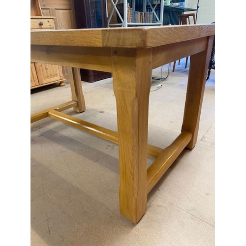 353 - Contemporary polished oak dining table, with stretcher, approx 135cm x 89cm x 75cm tall