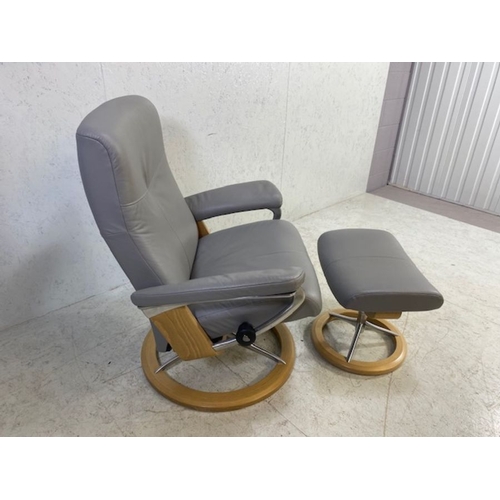 354 - Grey leather 'Stressless' reclining swivel armchair with matching footstool