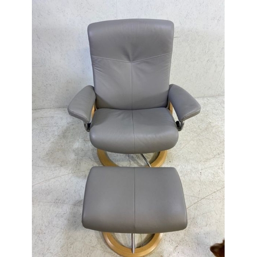 354 - Grey leather 'Stressless' reclining swivel armchair with matching footstool