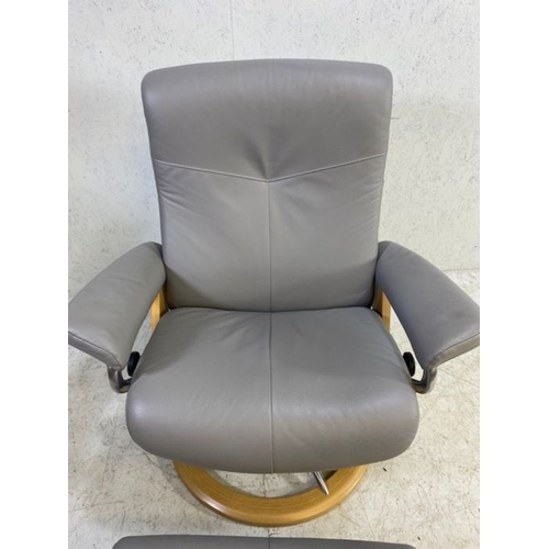 354 - Grey leather 'Stressless' reclining swivel armchair with matching footstool