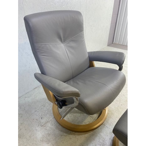 354 - Grey leather 'Stressless' reclining swivel armchair with matching footstool